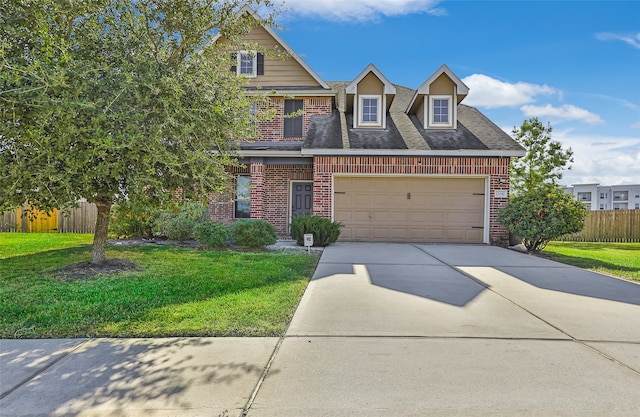 view of front of home featuring a front yard and a garage