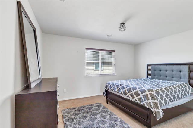 bedroom with light carpet