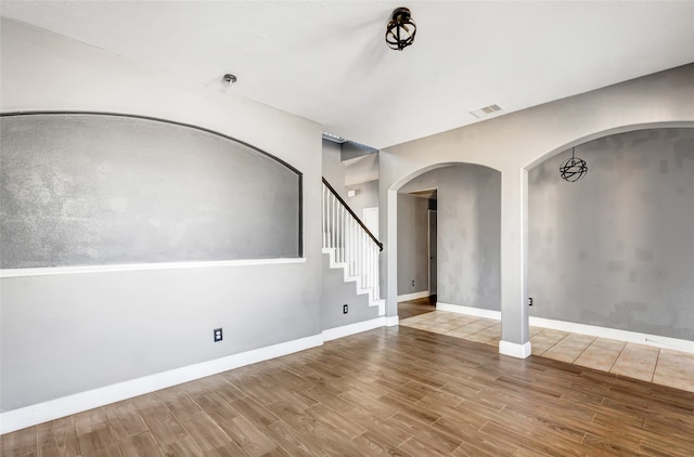 empty room with wood-type flooring