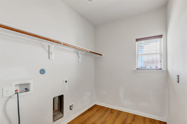 laundry room with hardwood / wood-style flooring, washer hookup, and electric dryer hookup