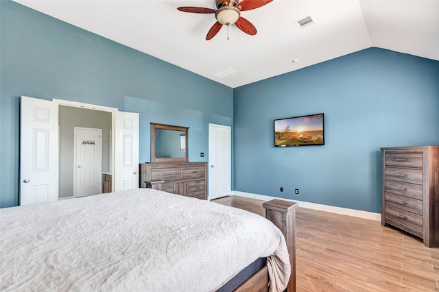 bedroom featuring vaulted ceiling, light hardwood / wood-style floors, and ceiling fan