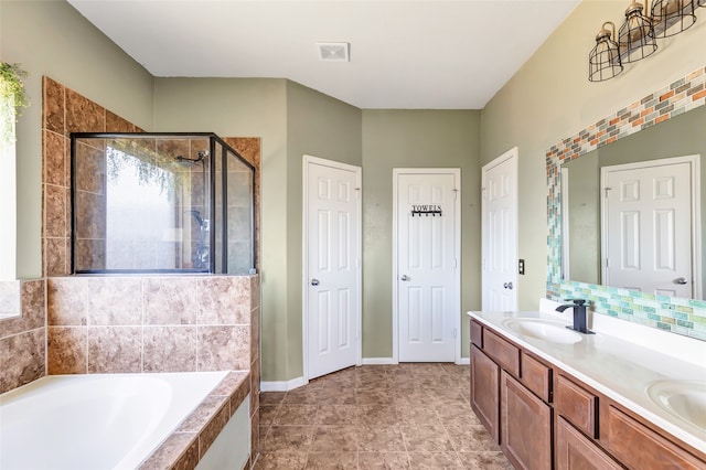 bathroom featuring vanity, separate shower and tub, and tile patterned flooring