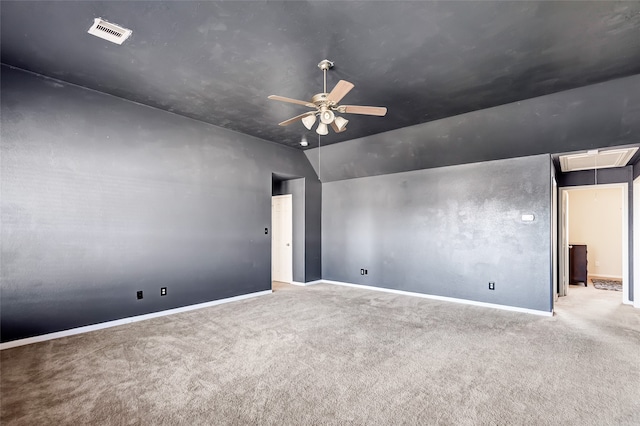 empty room with light carpet, lofted ceiling, and ceiling fan