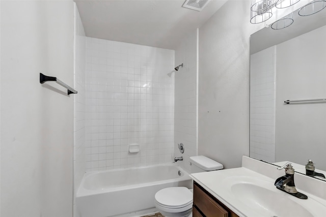 full bathroom featuring toilet, tiled shower / bath combo, and vanity