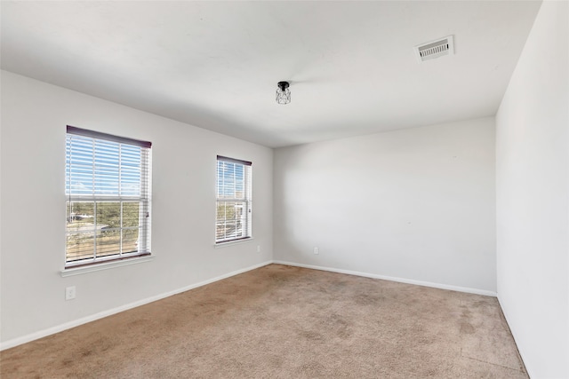 spare room with light carpet