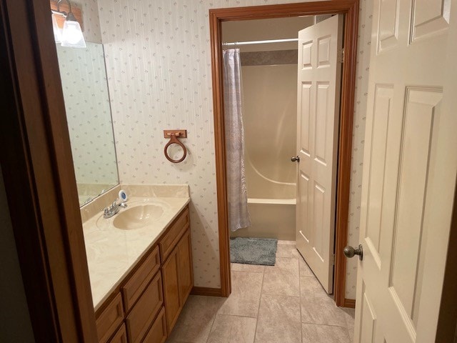 bathroom with vanity, shower / tub combo with curtain, and tile patterned flooring