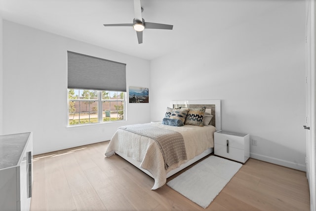 bedroom with light wood-type flooring and ceiling fan