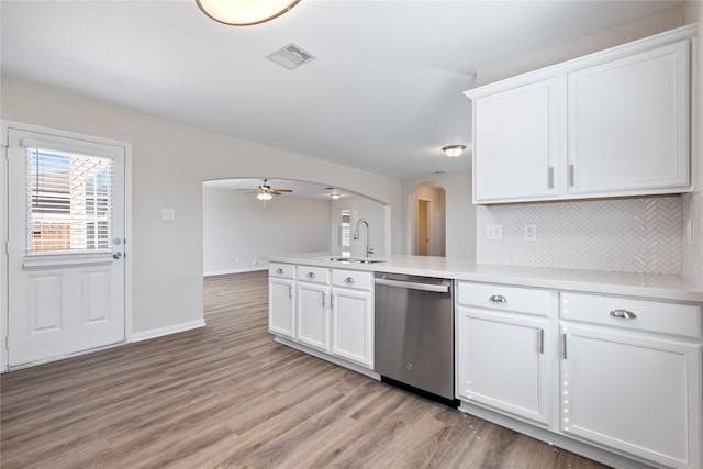 kitchen with sink, dishwasher, light wood-type flooring, and white cabinets