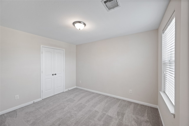 unfurnished room with carpet flooring