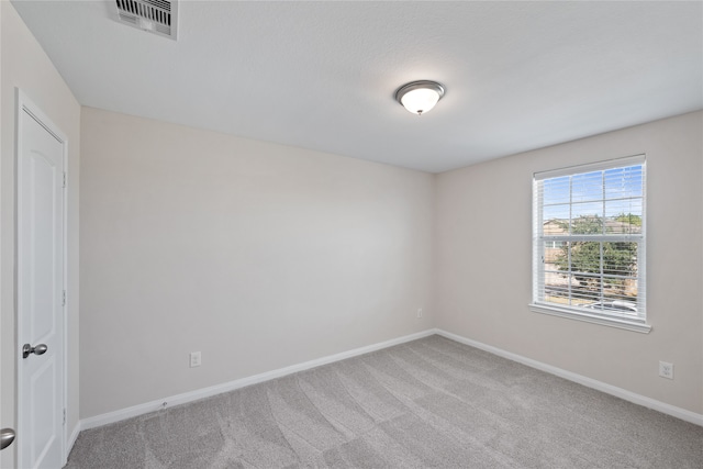 spare room featuring carpet flooring