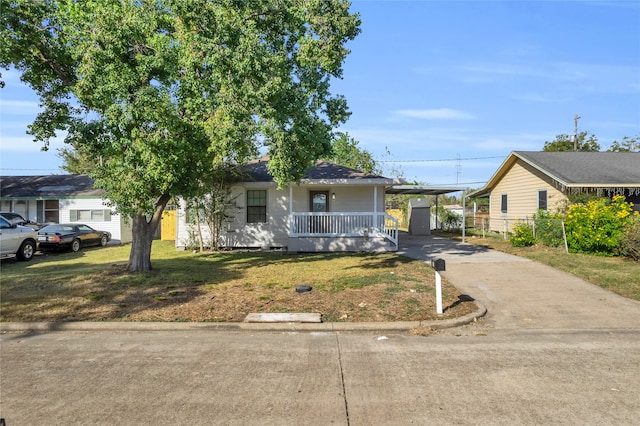 view of front facade with a front yard and a porch