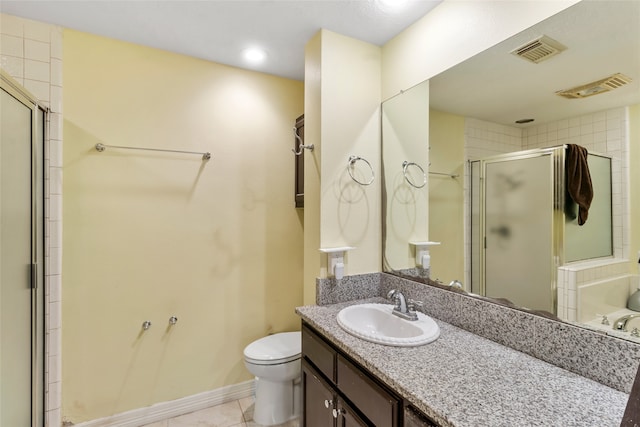 bathroom featuring vanity, toilet, a shower with shower door, and tile patterned flooring