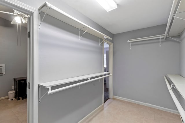 spacious closet featuring ceiling fan