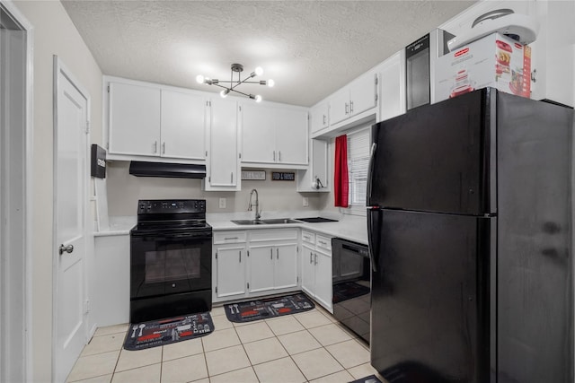 kitchen featuring sink, black appliances, white cabinetry, and a textured ceiling