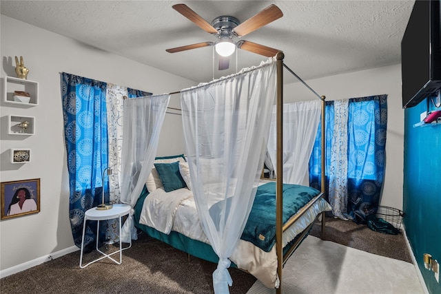 bedroom featuring ceiling fan, a textured ceiling, and carpet floors