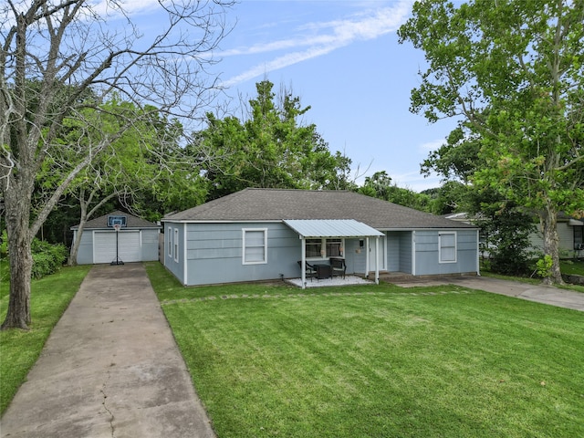 view of front of property with an outdoor structure, a front yard, covered porch, and a garage