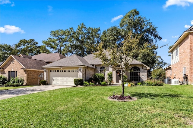 view of front of home featuring central air condition unit, a front lawn, and a garage