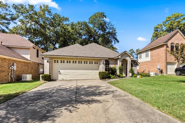 front facade with a garage and a front lawn