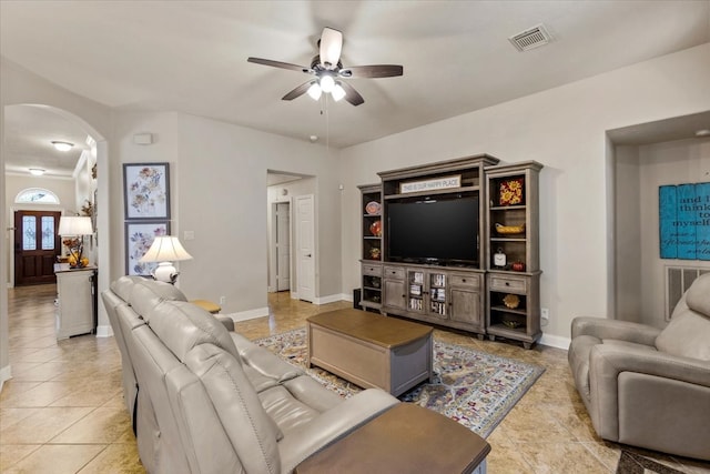 living room with ceiling fan and light tile patterned flooring