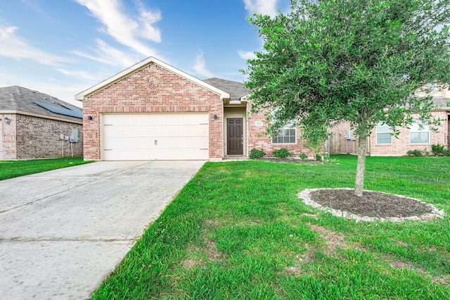 view of front of house with a garage and a front lawn