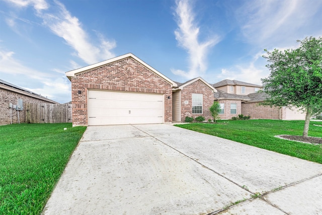 view of front facade with a front yard and a garage