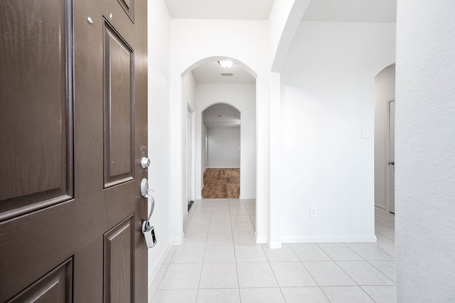 hallway with light tile patterned flooring