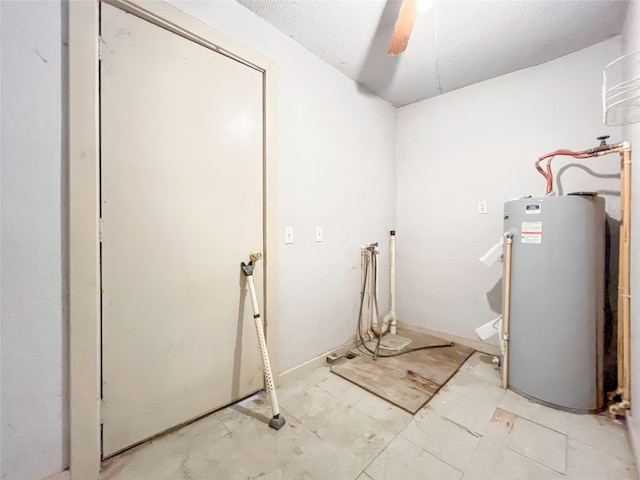 laundry room featuring a textured ceiling, ceiling fan, and gas water heater