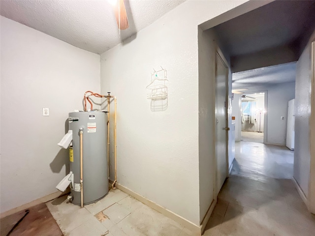 utility room featuring gas water heater