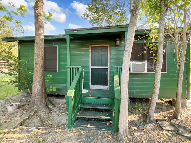 view of exterior entry featuring cooling unit