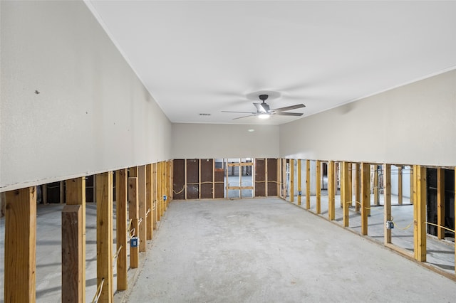 empty room featuring concrete floors and ceiling fan