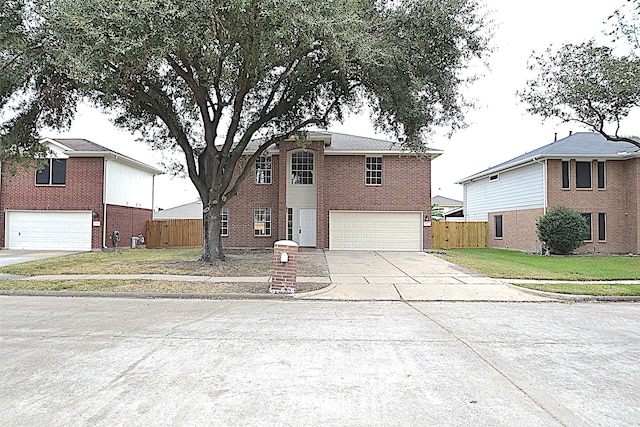 view of front of home with a front lawn and a garage