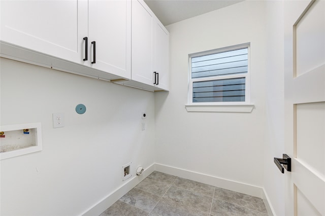 laundry room with hookup for an electric dryer, hookup for a washing machine, cabinets, light tile patterned floors, and hookup for a gas dryer