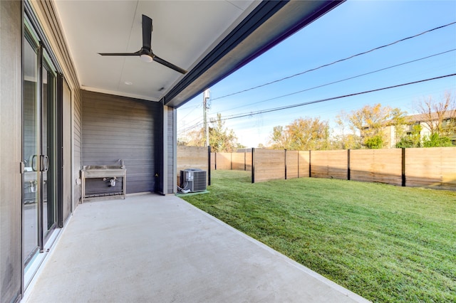 view of yard with central AC unit, a patio area, and ceiling fan