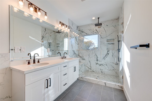 bathroom featuring tile patterned flooring, vanity, and a shower with shower door