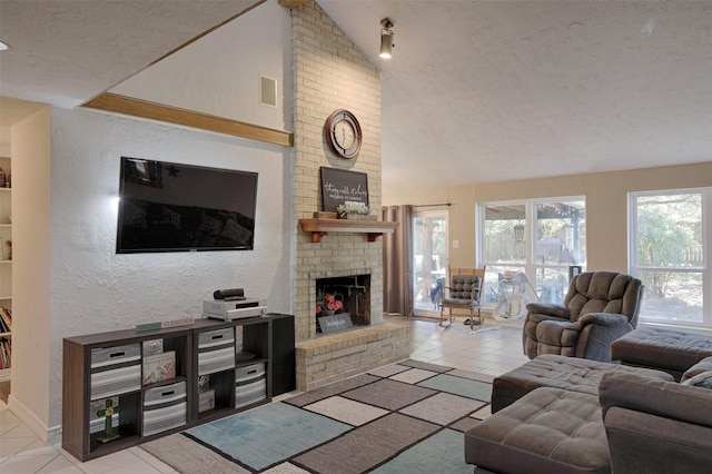 living room featuring lofted ceiling, a textured ceiling, light tile patterned floors, and a brick fireplace