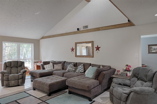 living room with a textured ceiling, high vaulted ceiling, and light tile patterned flooring