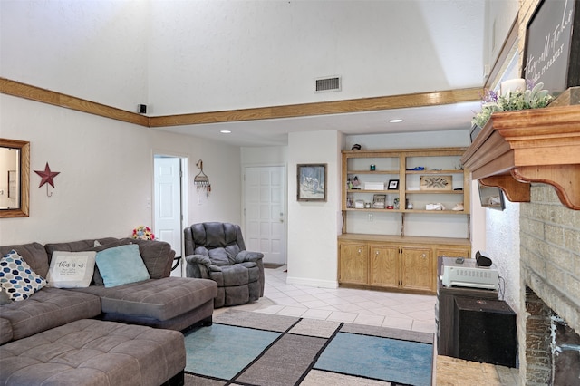 living room with light tile patterned flooring and a fireplace