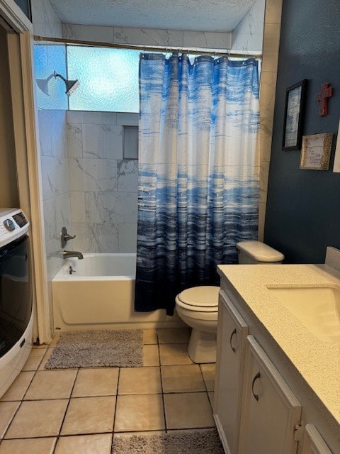 full bathroom with vanity, tile patterned flooring, shower / bath combo with shower curtain, a textured ceiling, and washer / clothes dryer