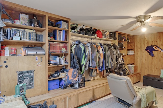 walk in closet with ceiling fan and light tile patterned floors