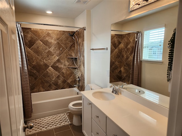 full bathroom with vanity, toilet, tile patterned floors, and shower / bath combo with shower curtain