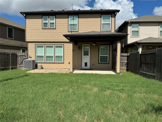 rear view of house with a yard, a patio area, cooling unit, and ceiling fan