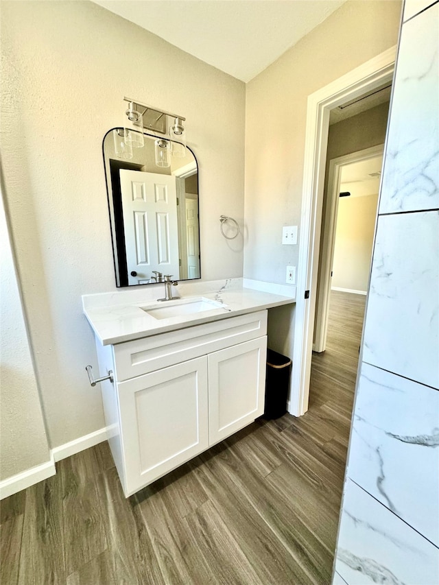 bathroom featuring vanity and wood-type flooring