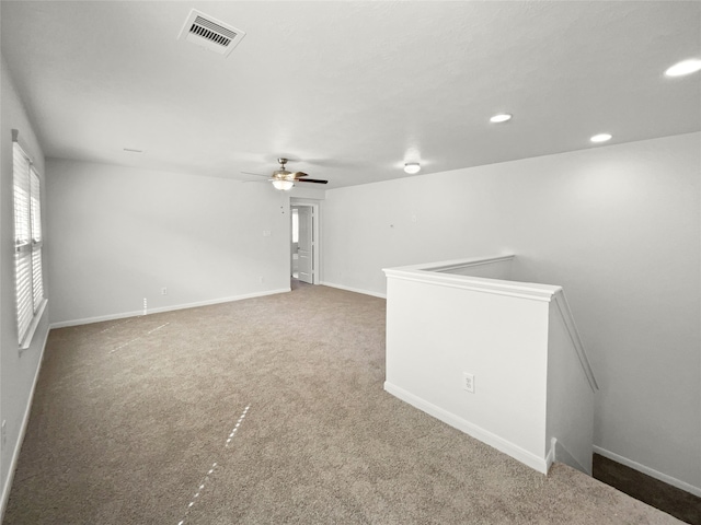 carpeted empty room with ceiling fan