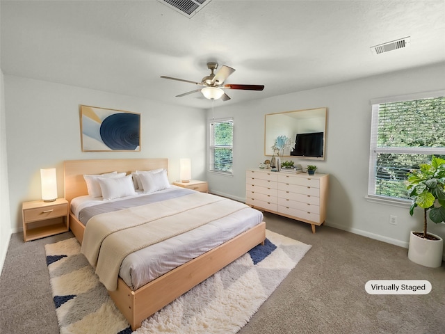 bedroom with light carpet and ceiling fan