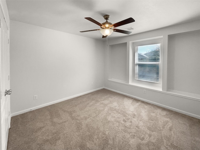 empty room featuring carpet and ceiling fan