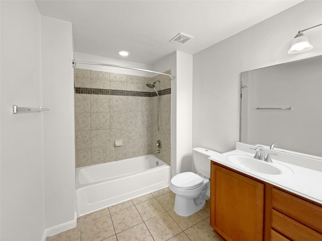 full bathroom with vanity, toilet, tile patterned floors, and tiled shower / bath combo