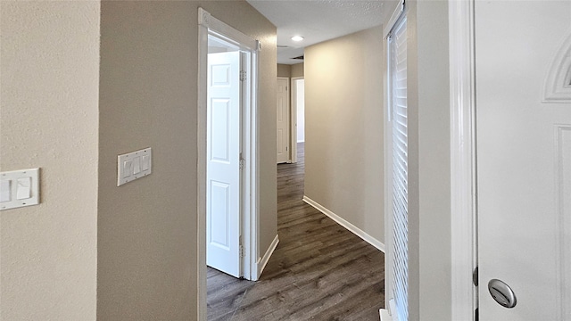 hall with dark hardwood / wood-style flooring