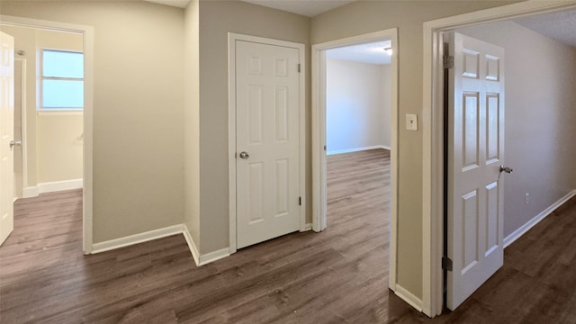 hallway featuring dark hardwood / wood-style floors