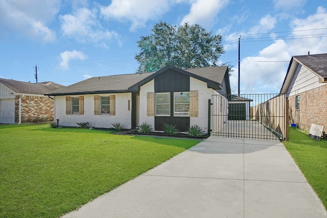 view of front facade with a front yard and a garage