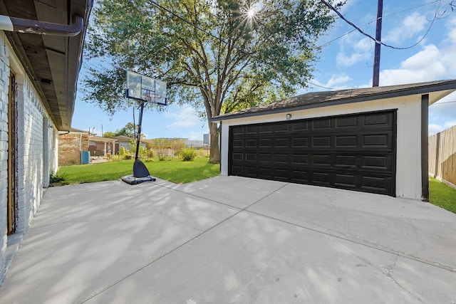 garage featuring a lawn